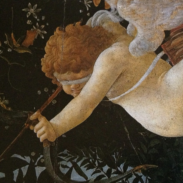 a blindfolded cupid flying and holding his bow and arrow