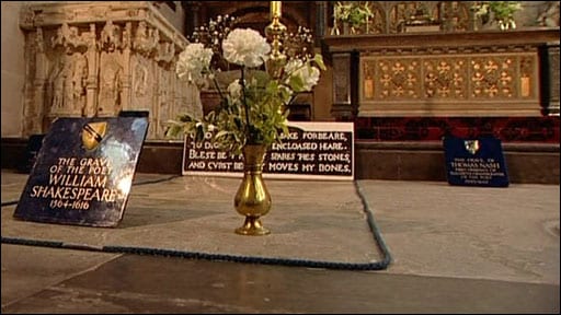 Shakespeare's grave in Holy Trinity Church, complete with curse and flowers