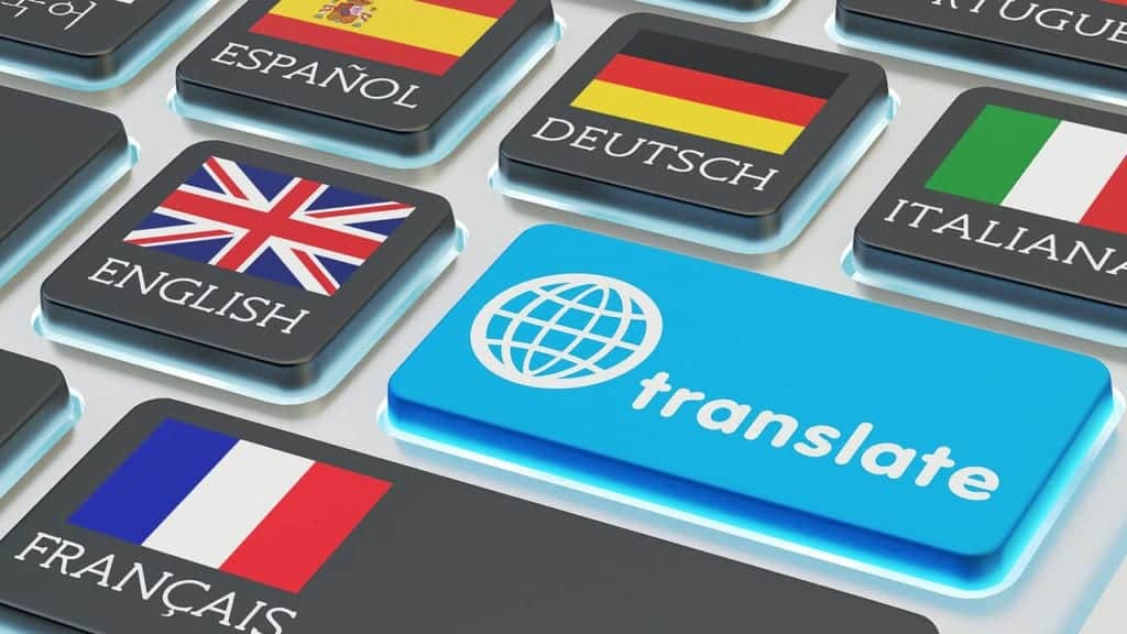 shakespeare translator computer keyboard with flags on keys, and large blue translate button