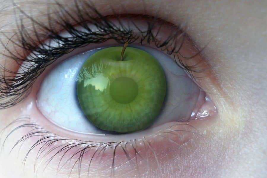 the apple of my eye - green apple reflected in an eye